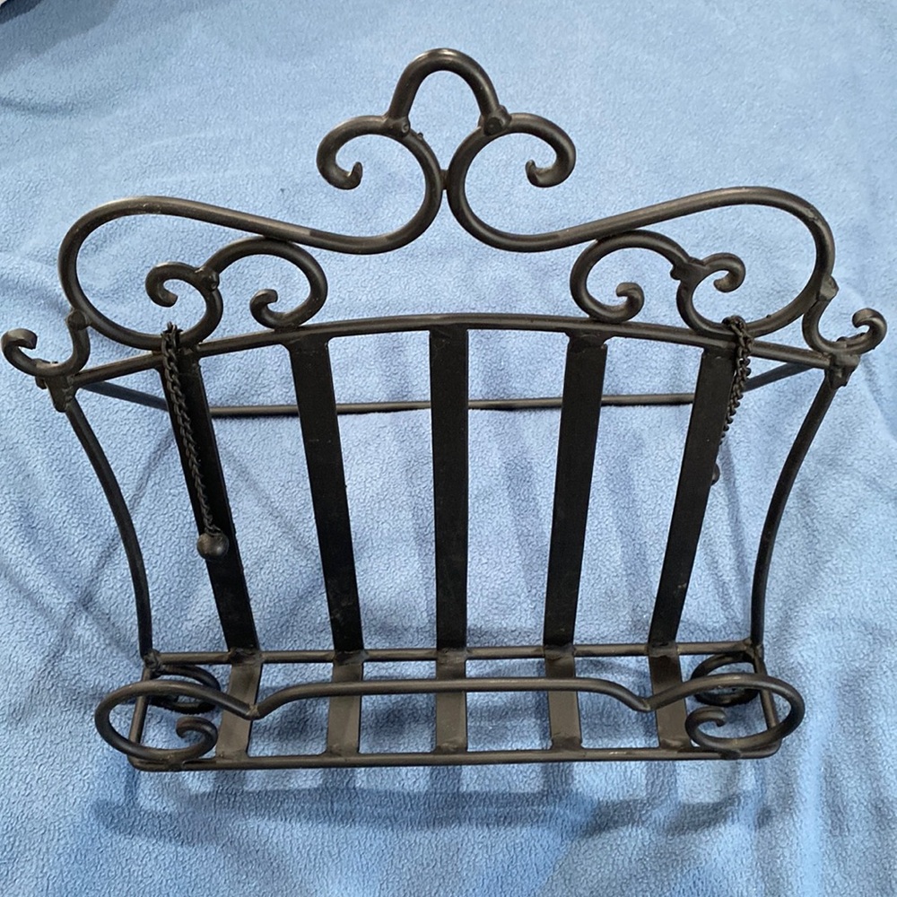 Wrought iron book holder. Hanging ball bearing to hold open book